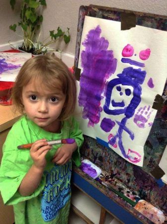 preschool_girl_painting_stick_figure_cadence_academy_preschool_tacoma_wa-336x450