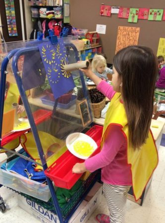 preschool_girl_painting_with_cardboard_brush_creative_expressions_learning_center_imperial_mo-333x450