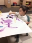 preschool_girl_painting_with_the_color_purple_cadence_academy_ofallon_mo-336x450