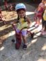 preschool_girl_participating_in_st_judge_trike-a-thon_cadence_academy_preschool_mount_pleasant_sc-338x450