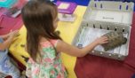 preschool_girl_petting_turtle_winwood_childrens_center_gainesville_ii_va-752x435