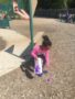 preschool_girl_picking_up_easter_egg_cadence_academy_eastfield_huntersville_nc-338x450