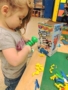 preschool_girl_playing_ants_in_the_pants_rogys_learning_place_hilltop_peoria_il-338x450