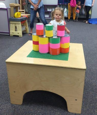 preschool_girl_playing_can_game_with_painted_face_rogys_learning_place_east_peoria_il-380x450