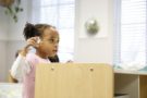 preschool_girl_playing_with_airplane_toy_winwood_childrens_center_leesburg_va-675x450