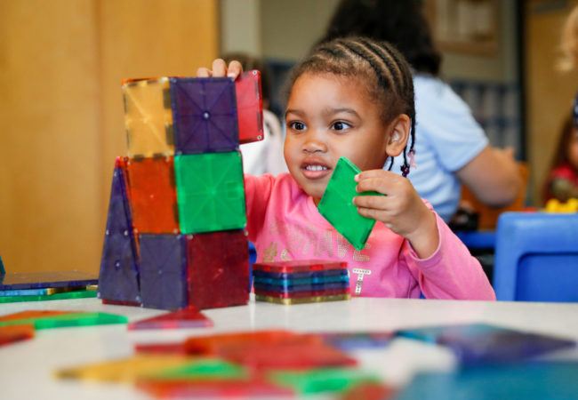 preschool_girl_playing_with_blocks_cadence_academy_montgomery_il-650x450