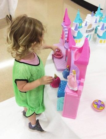 preschool_girl_playing_with_disney_princesses_at_cadence_academy_eastfield_huntersville_nc-344x450
