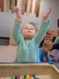 preschool_girl_playing_with_fuzzy_balls_cadence_academy_preschool_clive_ia-335x450