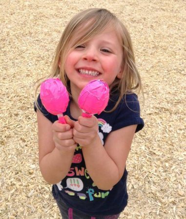 preschool_girl_playing_with_maracas_at_cadence_academy_preschool_ken_caryl_littleton_co-381x450