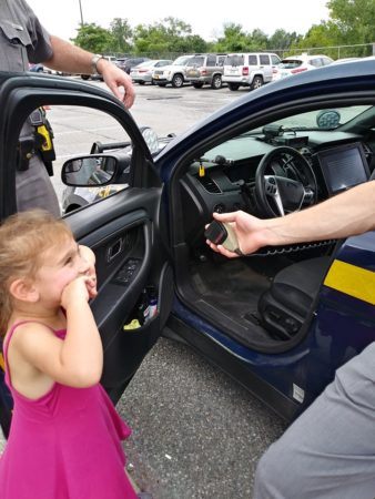 preschool_girl_playing_with_police_officer_creative_kids_childcare_centers_brewster-338x450