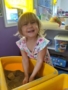 preschool_girl_playing_with_sand_creative_kids_childcare_centers_beekman-338x450