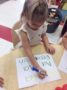 preschool_girl_practicing_her_letters_at_phoenix_childrens_academy_private_preschool_chandler_heights-336x450