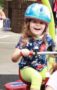 preschool_girl_riding_tricycle_with_helmet_carolina_kids_child_development_center_fort_mill_sc-287x450