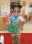 preschool_girl_showing_interlocking_manipulatives_at_cadence_academy_preschool_mallard_charlotte_nc-336x450