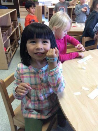 preschool_girl_showing_off_anna_band-aid_cadence_academy_preschool_dupont_wa-336x450