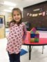 preschool_girl_showing_off_her_house_gateway_academy_mckee_charlotte_nc-338x450