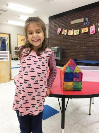 preschool_girl_showing_off_her_house_gateway_academy_mckee_charlotte_nc-338x450