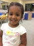 preschool_girl_smiling_in_classroom_at_cadence_academy_preschool_cypress_houston_tx-333x450