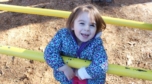 preschool_girl_smiling_on_playground_cadence_academy_preschool_smithfield_ri-752x418