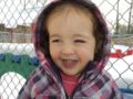 preschool_girl_smiling_on_playground_winwood_childrens_center_fairfax_va-600x450