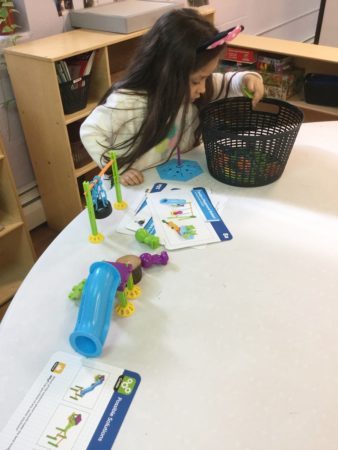 preschool_girl_soliving_engineering_puzzle_cadence_academy_preschool_cranston_ri-338x450