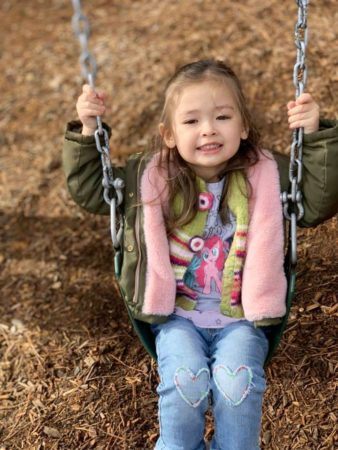 preschool_girl_swinging_sunbrook_academy_at_legacy_park-338x450