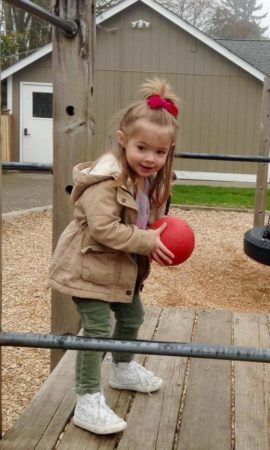 preschool_girl_with_ball_on_the_playground_cadence_academy_preschool_yelm_2_olympia_wa-270x450