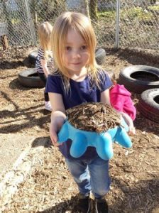 preschool_girl_with_dirt_pie_cadence_academy_preschool_gig_harbor_wa-336x450