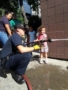 preschool_girl_with_fireman_cadence_academy_preschool_i_street_sacramento_ca-338x450