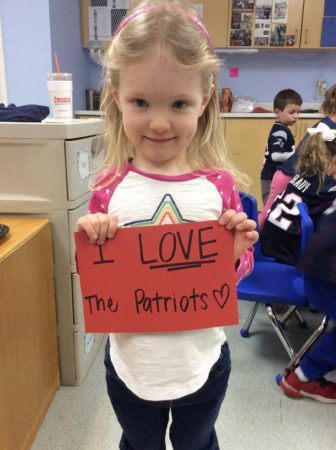 preschool_girl_with_i_love_patriots_sign_next_generation_childrens_centers_beverly_ma-336x450