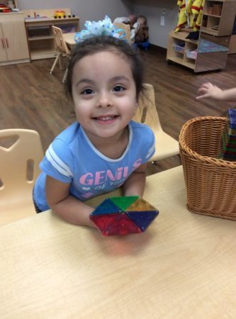 preschool_girl_with_manipulative_cadence_academy_preschool_cypress_houston_tx-333x450