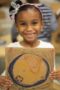 preschool_girl_with_map_of_the_world_cadence_academy_preschool_steele_creek_charlotte_nc-300x450