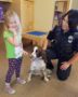 preschool_girl_with_police_officer_and_k9_cadence_academy_preschool_childrens_center_klamath_falls_or-362x450