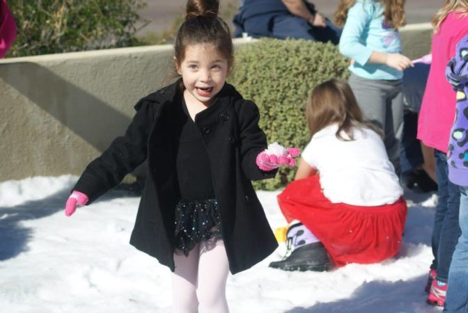 preschool_girl_with_snowball_at_phoenix_childrens_academy_private_preschool_happy_valley-672x450