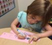 preschool_girl_writing_her_name_at_phoenix_childrens_academy_private_preschool_happy_valley-514x450