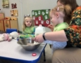 preschool_girls_and_teacher_enjoying_cooking_activity_rogys_learning_place_pekin_il-578x450