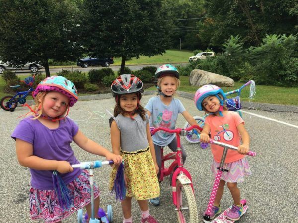 preschool_girls_biking_outside_jonis_child_care_preschool_canton_ct-600x450