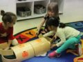 preschool_girls_creating_block_tunnel-cadence_academy_preschool_ankeny_ia-599x450