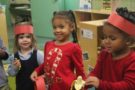 preschool_girls_eating_banana_cadence_academy_preschool_frisco_tx-675x450