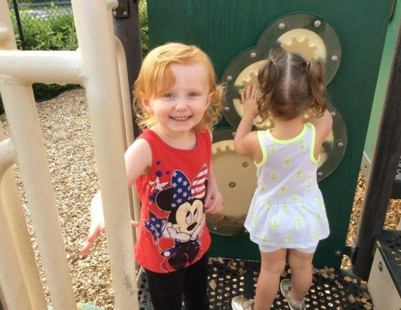 preschool_girls_enjoying_playground_sunbrook_academy_at_woodstock_ga-582x450