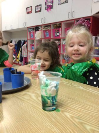 preschool_girls_enjoying_science_fair_at_phoenix_childrens_academy_private_preschool_thunderbird-336x450