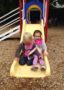 preschool_girls_going_down_slide_cadence_academy_preschool_cooper_point_olympia_wa-318x450