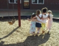 preschool_girls_holding_each_other_on_playground_sunbrook_academy_at_luella_mcdonough_ga-579x450