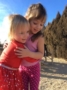 preschool_girls_hugging_on_playground_at_cadence_academy_preschool_columbine_littleton_co-333x450