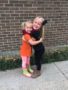 preschool_girls_hugging_outside_of_cadence_academy_preschool_branch_hollow_carrollton_tx-338x450