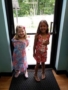 preschool_girls_in_floral_outfits_near_door_cadence_academy_preschool_lincoln_ri-338x450