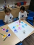 preschool_girls_painting_with_hands_cadence_academy_preschool_tacoma_wa-338x450