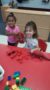 preschool_girls_playing_dinosaurs_cadence_academy_preschool_flower_mound_tx-248x450