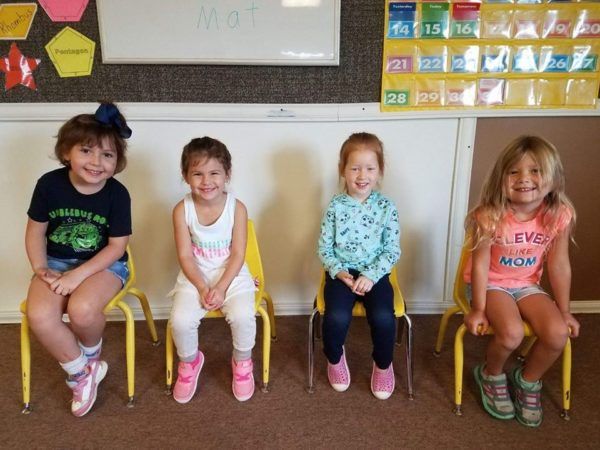 preschool_girls_sitting_during_circle_time_the_peanut_gallery_la_porte_tx-600x450