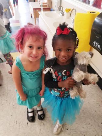 preschool_girls_smiling_for_the_camera_cadence_academy_preschool_charleston_sc-336x450